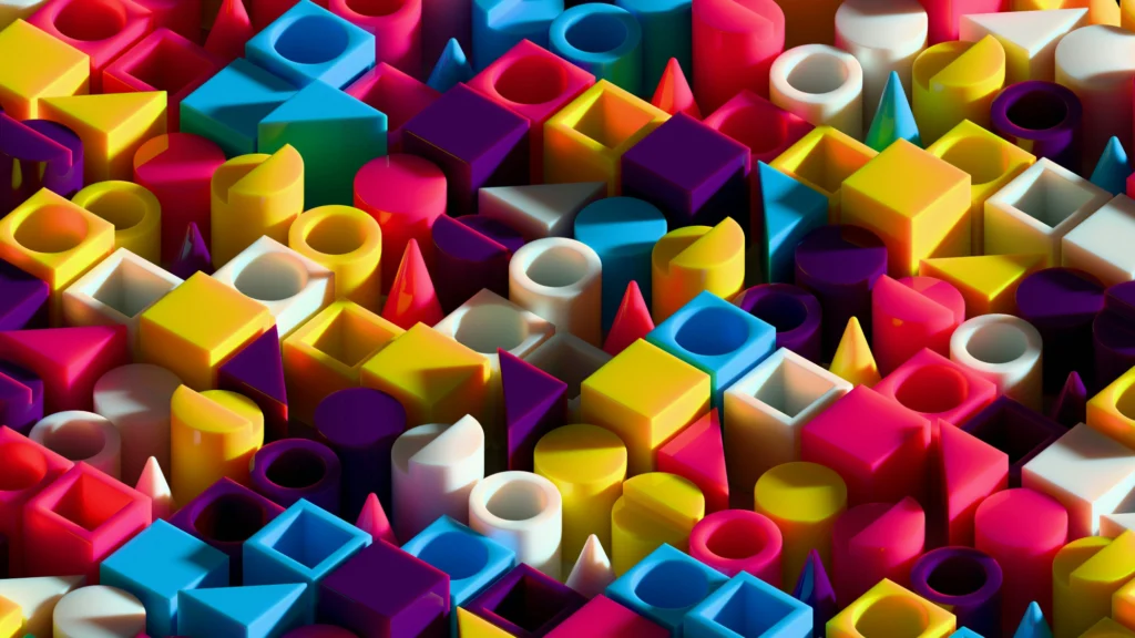 Gemini said Kolorowa mozaika geometrycznych brył z tworzywa sztucznego o nasyconych barwach i lśniącej powierzchni.